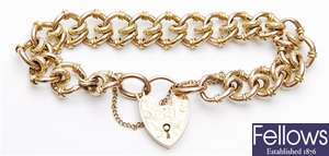 A fancy curb link bracelet each link with a