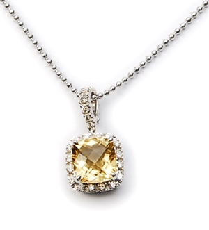 A citrine and diamond pendant, comprising a