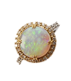 An opal and diamond cluster ring, comprising a