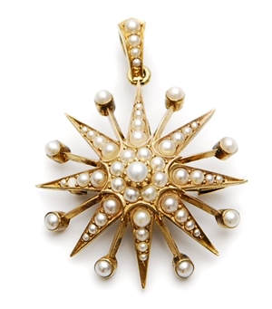 A split pearl set star design pendant, set with