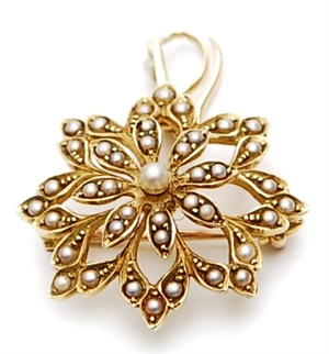 A floral design split pearl brooch, comprising a
