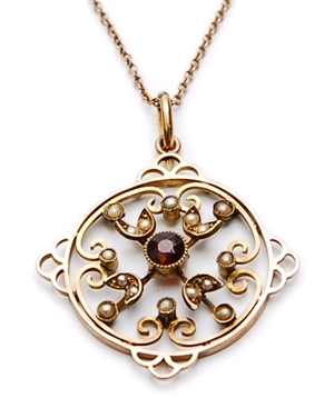 An early 20th century 9ct gold garnet and split