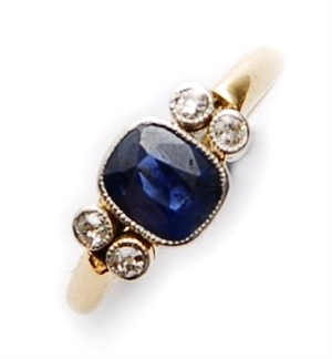 A sapphire and diamond ring, comprising a central