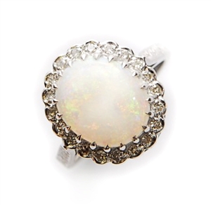 An opal and diamond cluster ring, comprising a