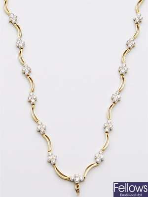 A diamond set necklace, comprising thirteen