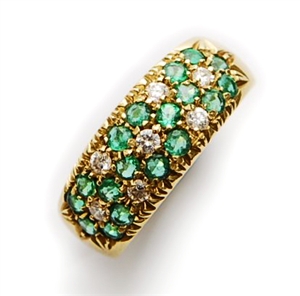 An 18ct gold emerald and diamond set band ring,