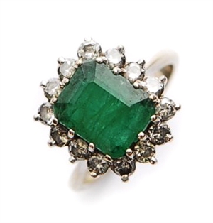An 18ct white gold emerald and diamond cluster