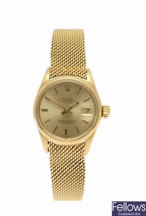 ROLEX - an 18k gold automatic lady's Oyster