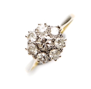 An 18ct gold diamond cluster ring, comprising a