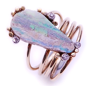 An abstract design boulder opal and diamond set