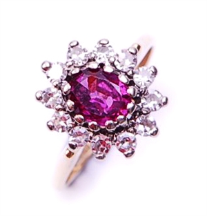 A ruby and diamond set cluster ring, comprising