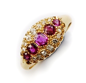 An Edwardian 18ct gold ruby and diamond cluster