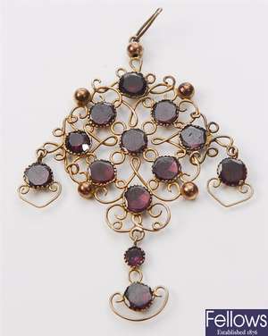 An early 20th century garnet set pendant,