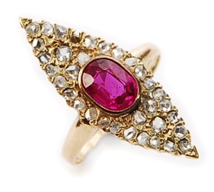 A synthetic ruby and diamond set marquise shaped