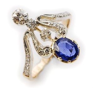 A sapphire and diamond set open work up finger