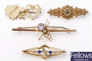 Four brooches, to include an amethyst and split