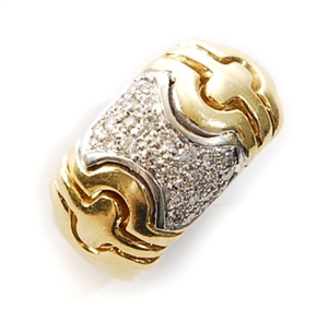 An 18ct gold diamond set band ring, comprising a