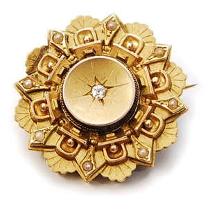 A Victorian 15ct gold circular brooch, comprising