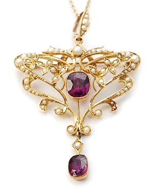 An early 20th century 15ct gold ornate garnet and