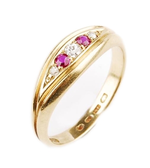 An 18ct gold ruby and diamond five stone ring. 
