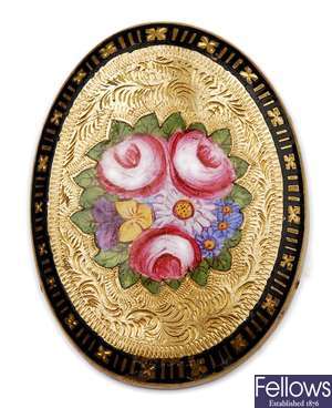 An oval enamelled brooch, with a central