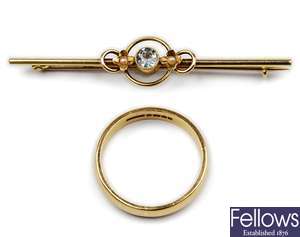 An 18ct gold band ring together with an aquamarine bar brooch.