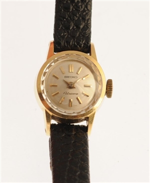 An 18k gold manual wind lady's Seiko wrist watch,