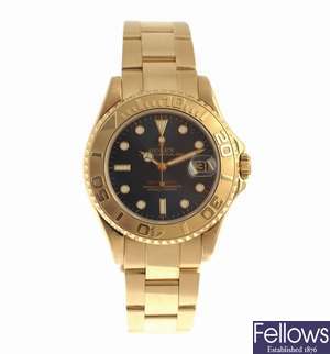 ROLEX - an 18k gold automatic mid size