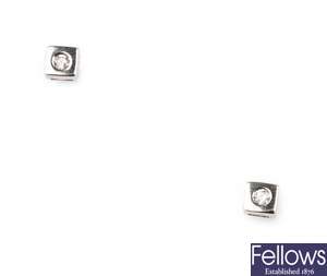 A pair of 18ct white gold square shaped stud