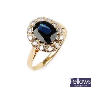 An 18ct gold oval sapphire and diamond cluster