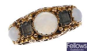 A 15ct gold ring, set with three opals,