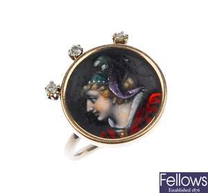 An enamel ring featuring the profile of a woman