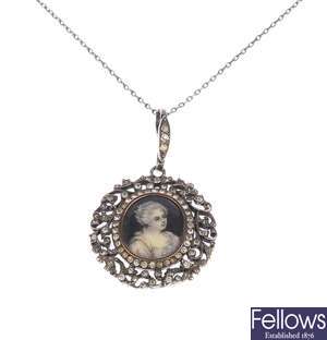 A paste and silver memorial pendant featuring the