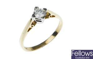 An 18ct gold single stone diamond ring in a four