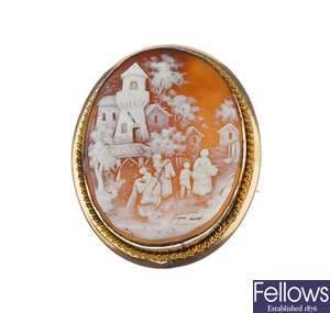 A collection of cameo and wedgewood brooches