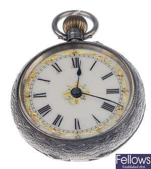 A silver open face, top wind fob watch with cream