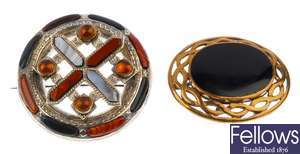 A round Scottish themed brooch set with opaque