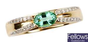 An 18ct gold emerald and diamond ring, the