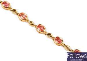 An 18ct gold orange sapphire set bracelet, set