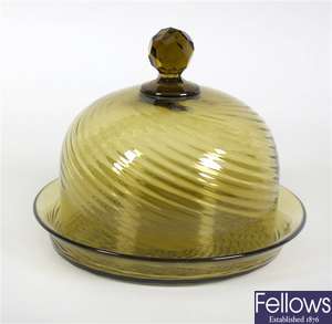 An early 20th century green glass cheese dish