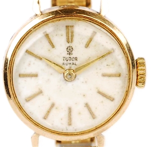 A ladies Tudor Royal watch with golden hands and