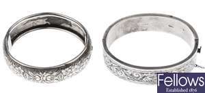 Seven assorted hinged silver bangles with foliate