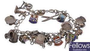 Eleven silver curb link bracelet with charms