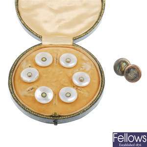 A cased set of six mother of pearl dress studs.