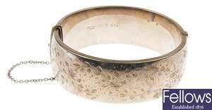 Seven silver/white metal bangles, to include a