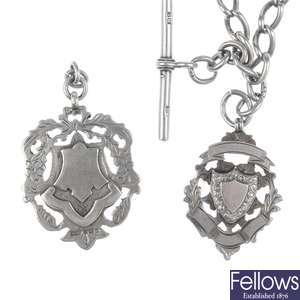 Early 20th century silver shield medalion and Albert chain with medallion and T-bar.