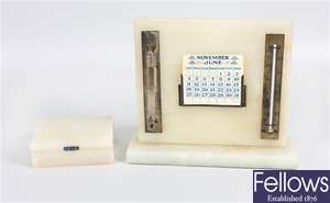 A small marble box and matching desk calendar
