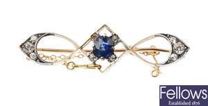 A diamond and sapphire brooch.