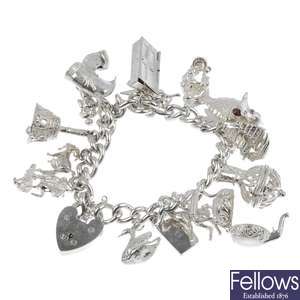Three silver charm bracelets and two Alberts.