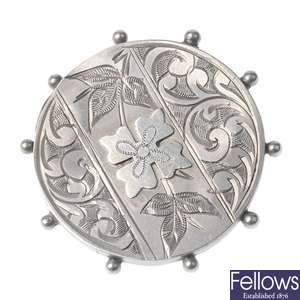 Twelve late 19th/early 20th century silver brooches.